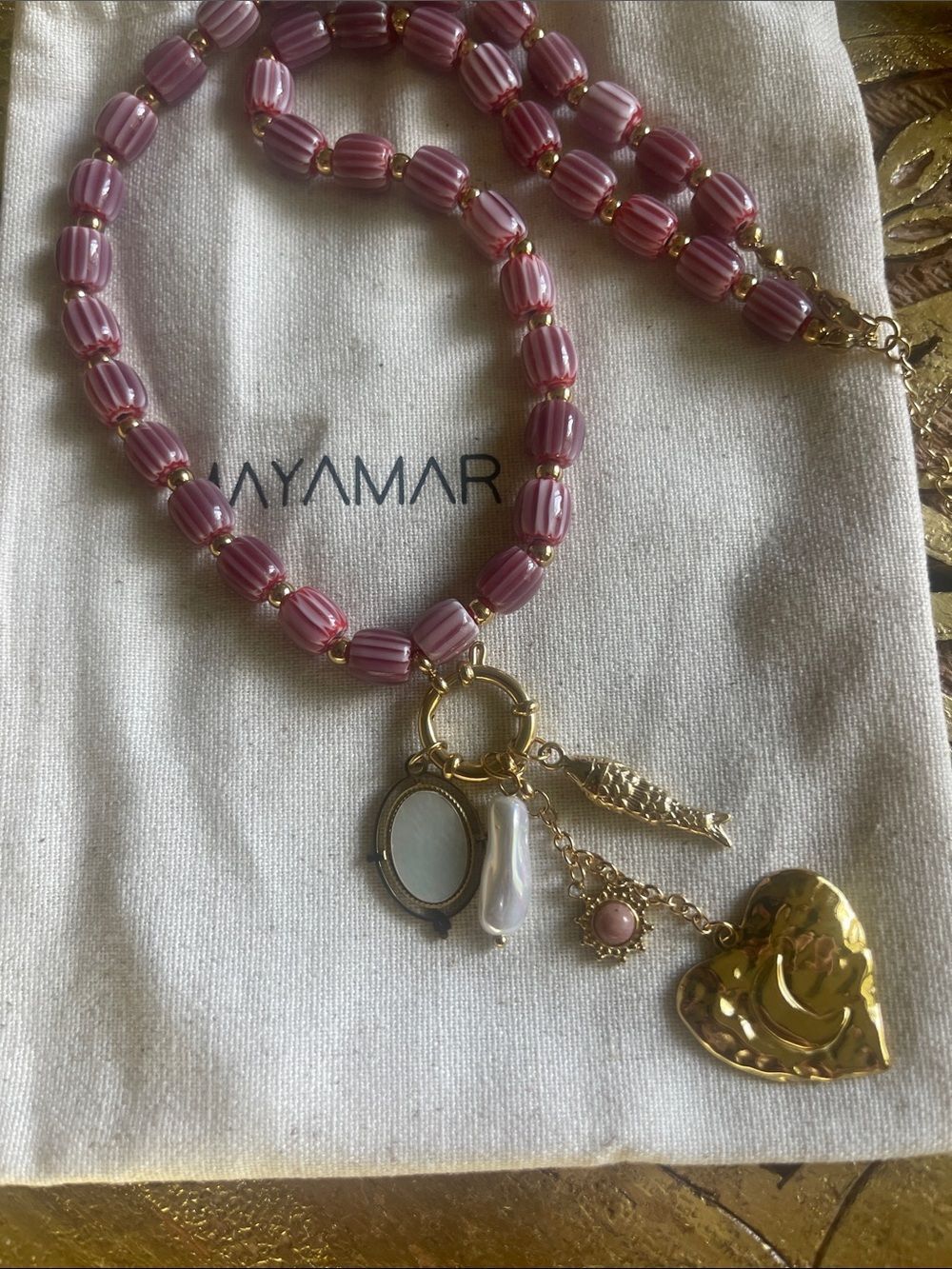 Gold Charm Necklace with Burgundy Ceramic Beads (fish, heart, freshwater pearl)